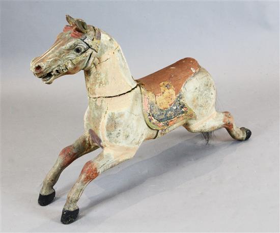 An early 20th century carved and painted wood carousel horse, W.39in. H.27in.